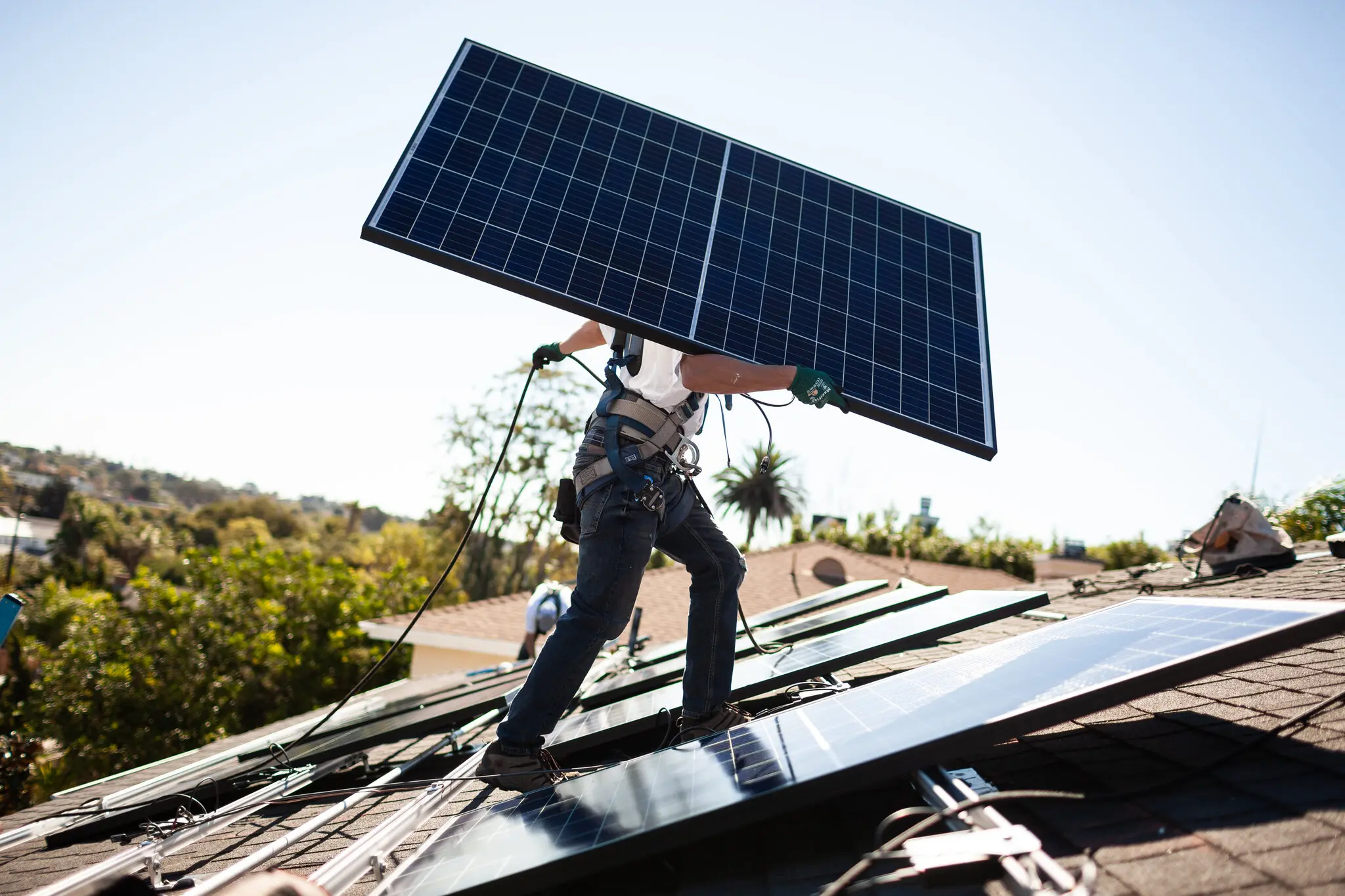 installing solar panels on rooftop of house