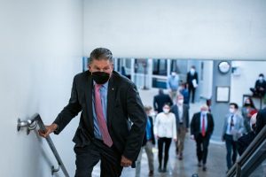 Senator Joe Manchin climbing stairs