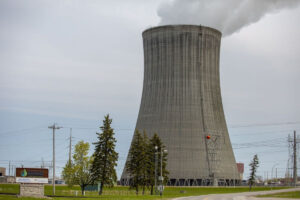 nuclear cooling tower with steam emitting from top