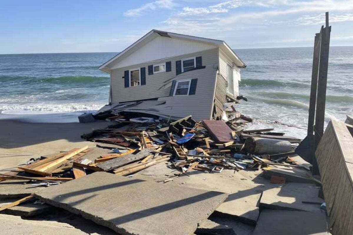 House falling into the sea